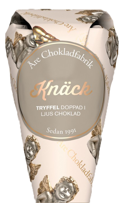 Knäcktryffel doppad i ljus choklad i dekorativ strut, från Åre Chokladfabrik